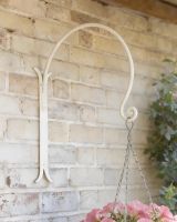 Digital illustration of ’Shepherds Crook’ Wall Bracket for Hanging Baskets - Cream shed mounted on a brick wall