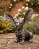 Digital Illustration of Silver Basset Sculpture on a Garden Patio in Front of a Rose Covered Wall