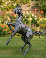 Digital illustration of the "Spirit" Horse Sculpture in a garden at sunset