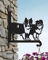 Digital Illustration of the Steel Border Collie Pair Hanging Basket Bracket Mounted on a Stone Wall