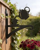 Digital illustration of Teapot & Cup Iron Hanging Basket Bracket mounted on a garden fence