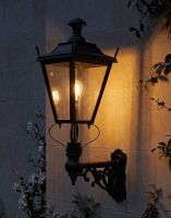 Digital Illustration of the 102 x 54cm Black Dorchester Wall Lantern on an Ornate Bracket Lit up at Night