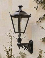 Digital Illustration of the 102 x 54cm Black Dorchester Wall Lantern on an Ornate Bracket Mounted on a Sandstone Brick Wall