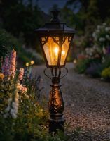 Digital Illustration of the 105cm “Gothic Design” Driveway and Patio Lighting Placed on a Flowery Gravel Driveway and Lit up at Night