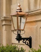 Digital Illustration of the 115 x 51cm Copper Wall Lantern on a Royale Bracket Mounted on a Sandstone Brick Building Entanceway