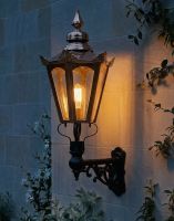 Digital Illustration of the 115 x 53cm Copper Hexagonal Wall Lantern on an Ornate Bracket Lit up at Night 