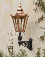 Digital Illustration of the 115 x 53cm Copper Hexagonal Wall Lantern on an Ornate Bracket Mounted on a Sandstone Brick Garden Wall