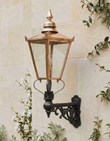 Digital Illustration of the 115 x 65cm Copper Wall Lantern on an Ornate Bracket Mounted on a Sandstone Brick Garden Wall