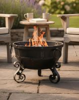 Digital Illustration of the "Dipendu" Wrought Iron Kadai Fire Pit Fully Lit Next to Garden Furniture