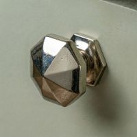 Digital Illustration of the 32mm Cast Iron Octagonal Cabinet Knob Mounted on a Sage Green Cupboard Door