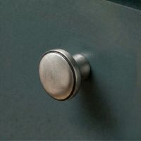 Digital Illustration of the 32mm Natural Cast Iron Cabinet Knob Mounted on a Blue Kitchen Cupboard
