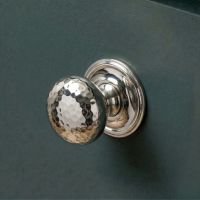 Digital Illustration of the 38mm Bright Chrome Hammered Mushroom Cabinet Knob Mounted on a Blue Cupboard Door