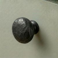 Digital Illustration of the 38mm Hammered Steel Cabinet Knob Mounted on a Sage Green Cupboard Door 