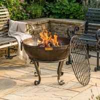 Digital Illustration of the 60cm Version of the Iron Kadai Bowl Fully Lit in Front of Rustic Garden Furniture Digital Illustration of the 60cm Version of the Iron Kadai Bowl Fully Lit in Front of Rustic Garden Furniture