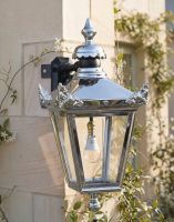 Digital Illustration of the 63 x 47.5cm Bright Chrome Suspended Corner Wall Lantern Mounted on a Limestone Brick Wall