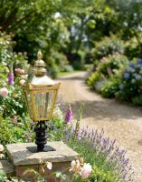 Digital Illustration of the 64cm Polished Brass Harrogate Pillar Light and Lantern Set Mounted on a Driveway Garden Wall