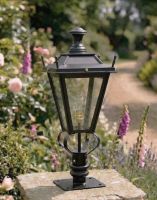 Digital Illustration of the 71cm Black Dorchester Pillar Light and Lantern Set Mounted on a Stone Garden Pillar Surrounded by Flowers