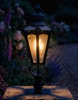 Digital Illustration of the 76cm Black Hexagonal Pillar Light and Lantern Set Mounted on a Stone Pillar in a Garden Viewed from an Angle Lit up at Night