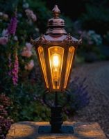 Digital Illustration of the 76cm Copper Hexagonal Pillar Light and Lantern Set Mounted on a Stone Garden Pillar Viewed Face on and Lit up at Night