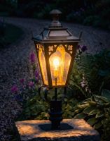 Digital Illustration of the 81cm Brass Gothic Pillar Light and Lantern Set Mounted on a Stone Garden Wall Pillar and Lit up at Night