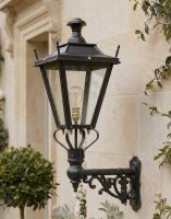 Digital Illustration of the 84 x 37cm Black Dorchester Wall Lantern on Ornate Bracket Mounted on a Traditional House Entranceway