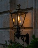 Digital Illustration of the 84 x 37cm Brass Dorchester Wall Lantern on a Royale Bracket Lit up at Night 