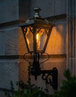Digital Illustration of the 84 x 37cm Brass Gothic Wall Lantern on a Royale Bracket Lit up at Night