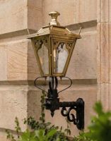 Digital Illustration of the 84 x 37cm Brass Gothic Wall Lantern on a Royale Bracket Mounted on a wall of a Sandstone Brick Building