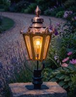 Digital Illustration of the 86cm Copper Hexagonal Pillar Light and Lantern Set Mounted on a Stone Garden Wall Pillar and Lit up at Night