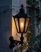 Digital Illustration of the 88 x 33cm Black Hexagonal Wall Lantern on Corner Bracket Lit up at Night