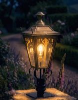 Digital Illustration of the 90cm Brass Gothic Pillar Light and Lantern Set Positioned next to a Flowery Gravel Driveway and Lit up at Night Digital Illustration of the 90cm Brass Gothic Pillar Light and Lantern Set Positioned next to a Flowery Gravel Driveway and Lit up at Night