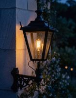 Digital Illustration of the 95 x 48cm Black Dorchester Lantern on a Corner Bracket Lit up at Night