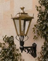 Digital Illustration of the 95 x 48cm Brass Dorchester Lantern on an Ornate Bracket Mounted on a Sandstone Brick Garden Wall
