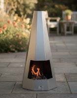 Digital Illustration of the 95cm Contemporary Hexagonal Chiminea Fully Lit on a Garden Patio oat Sunset