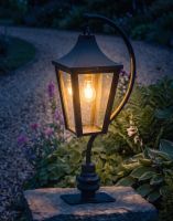 Digital Illustration of the 96cm Black Swan Neck Pillar Light & Lantern Set Mounted on a Stone Garden Pillar and Lit up at Night