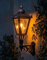 Digital Illustration of the 98 x 46cm Copper Wall Lantern on an Ornate Bracket Lit up at Night