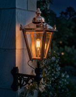 Digital Illustration of the 98 x 46cm Copper Wall Lantern on a Corner Bracket Lit up at Night