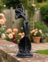 Digital Illustration of the Aged Black Lady Standing on Clam Sculpture on a Garden Wall with Pink Roses Behind it