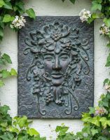 Digital Illustration of the Aged Bronze Green Woman Wall Decoration on an Outside Wall