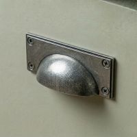 Digital Illustration of the Aged Pewter Rectangular Drawer Pull with Curved Handle Mounted on a Sage Green Cupboard Door. Digital Illustration of the Aged Pewter Rectangular Drawer Pull with Curved Handle Mounted on a Sage Green Cupboard Door.