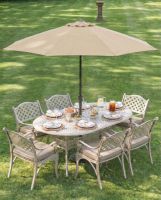 digital_illustration_of_the_antique_champagne_22montacute_22_six_seater_garden_table_chair_set_dressed_for_dining with cushions and parasol