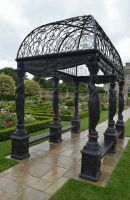 Digital illustration of The "Athenian Goddess" Black Royal Palace Gazebo in a manor garden