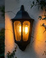 Digital Illustration of the Black "Bridlington" Flush Wall Lantern Lit up at Night