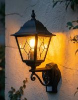 Digital Illustration of the Black "Sheringham" Traditional Wall Lantern with Built in PIR Sensor Lit up at Night