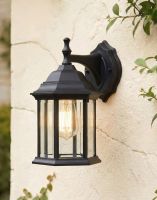 Digital Illustration of the Black 30cm x 17cm Version of the Traditional "Hexagonal" Victorian Top-Fix Wall Lantern Mounted on a White Garden Wall