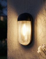Digital Illustration of the Black Contemporary "Hurley" Cylinder Wall Light Lit up at Night 
