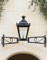 Digital Illustration of the Black Dorchester Bow Bracket Light Mounted Abouve a Grand Limestone Brick Archway