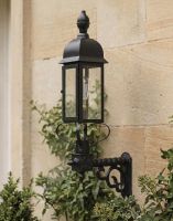 Digital Illustration of the Black Slimline 102 x 47cm Traditional Victorian Wall Light Mounted on a Traditional Sandstone Brick House Entranceway
