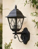Digital Illustration of the Black Version of the Traditional Victorian Outdoor Wall Lantern with Ornate Bracket Attached and Mounted on a Cream Coloured Garden Wall