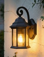 Digital Illustration of the Black Version of the Traditional Aluminium Ornate Top Fix Wall Lantern Lit up at Night